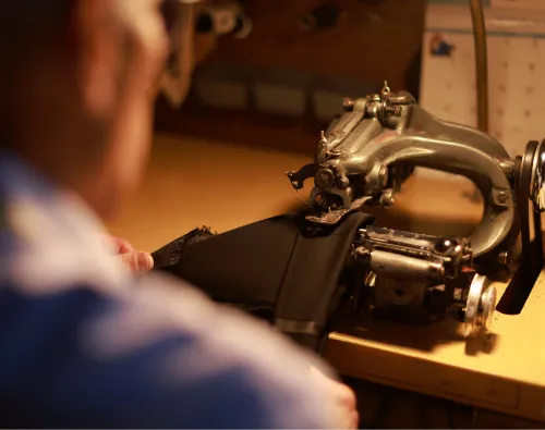 Staff at Biltmore Tuxedos making alterations to a pair of pants